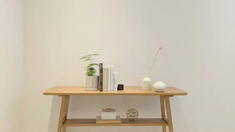 Carved and marble top console tables in the Anthropologie style
