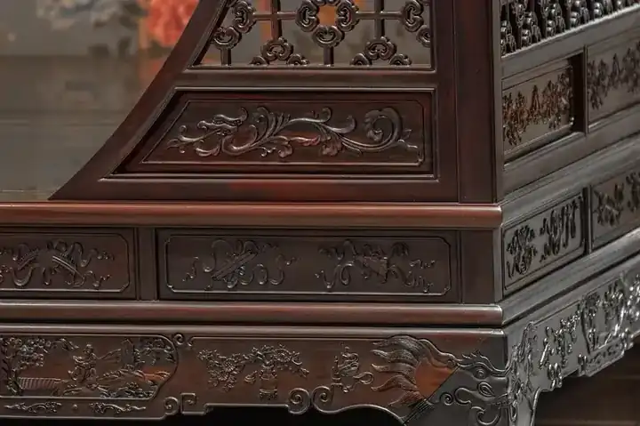 Solid rosewood bed with deep reddish-brown grain and carved headboard, handcrafted in Jodhpur, India